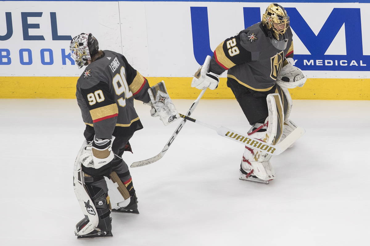 Vegas Golden Knights goalie Robin Lehner (90) and goalie Marc-Andre Fleury (29) tap sticks duri ...