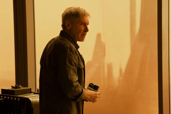 Rick Deckard (Harrison Ford) looks out at an irradiated Las Vegas in "Blade Runner 2049." (Step ...
