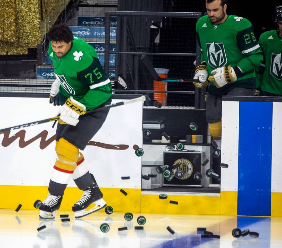 Golden Knights right wing Ryan Reaves (75) and teammate left wing William Carrier (28) take to ...