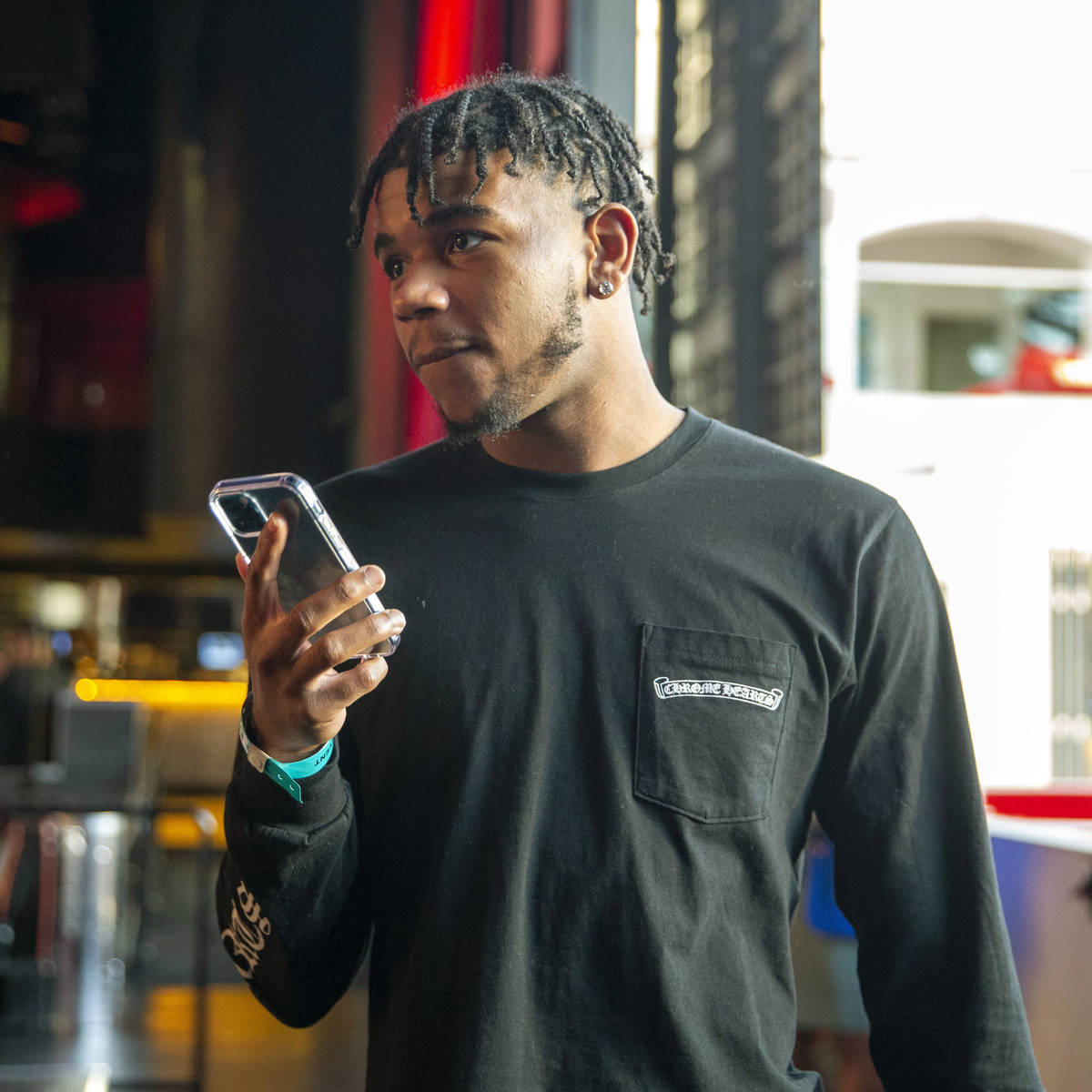 Jaden Hardy, a Coronado High School basketball prospect, speaks on the phone at an event to an ...