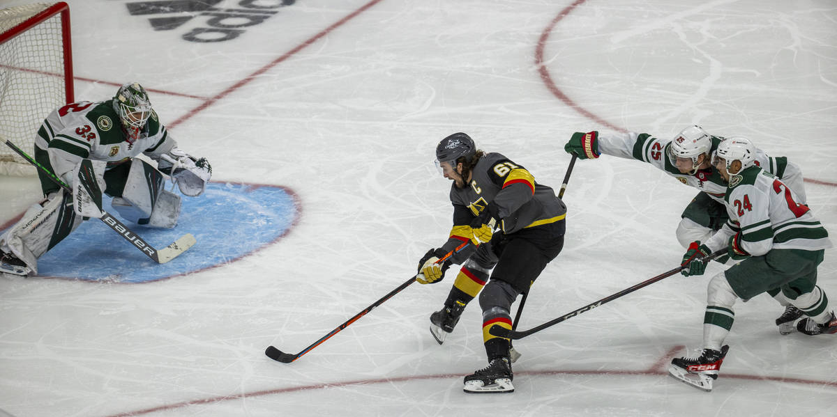 Golden Knights right wing Mark Stone (61) looks to shoot on Minnesota Wild goaltender Cam Talbo ...