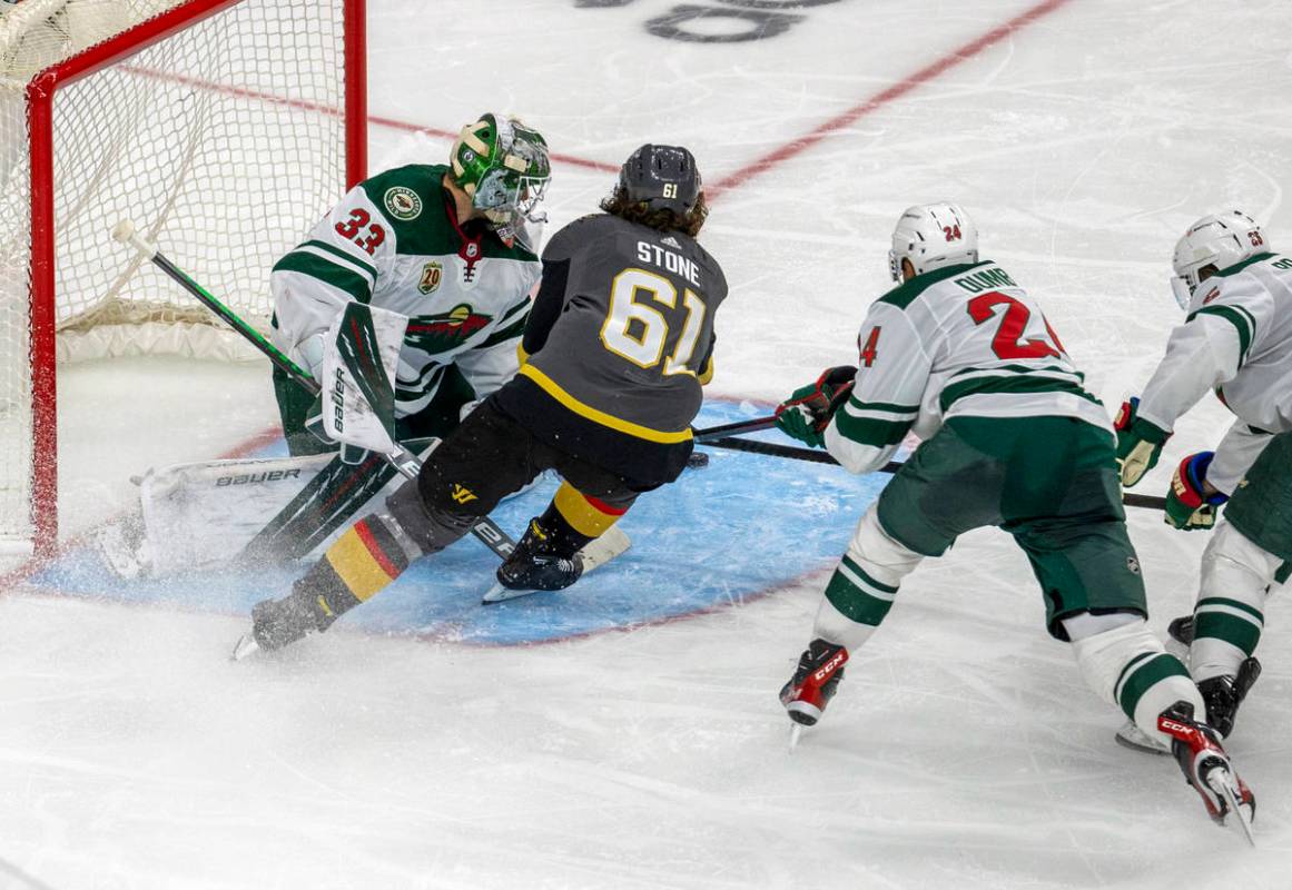 Golden Knights right wing Mark Stone (61) looks to shoot on Minnesota Wild goaltender Cam Talbo ...