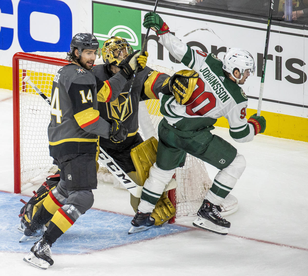 Golden Knights defenseman Nicolas Hague (14) and teammate goaltender Marc-Andre Fleury (29) kee ...