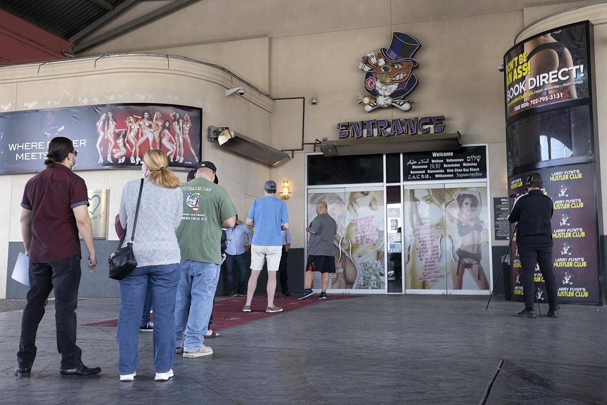 Vaccine seekers wait in line for a pop-up COVID-19 vaccine clinic put on by the Southern Nevada ...