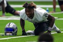 Las Vegas Raiders wide receiver Henry Ruggs III (11) stretches during a practice session at the ...