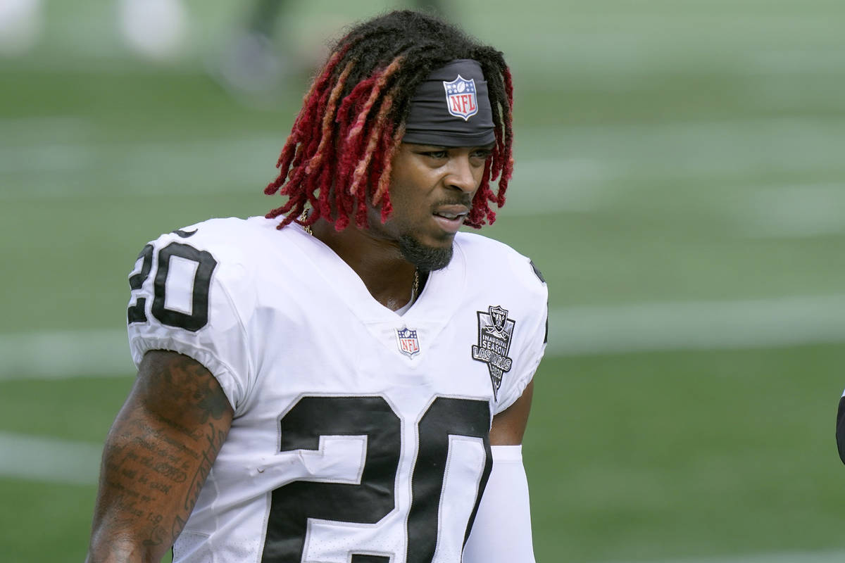 Las Vegas Raiders defensive back Damon Arnette warms up before an NFL football game against the ...