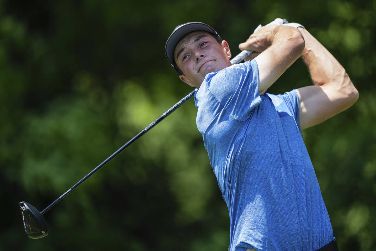 Viktor Hovland watches his tee shot on the seventh hole during the fourth round of the Wells Fa ...