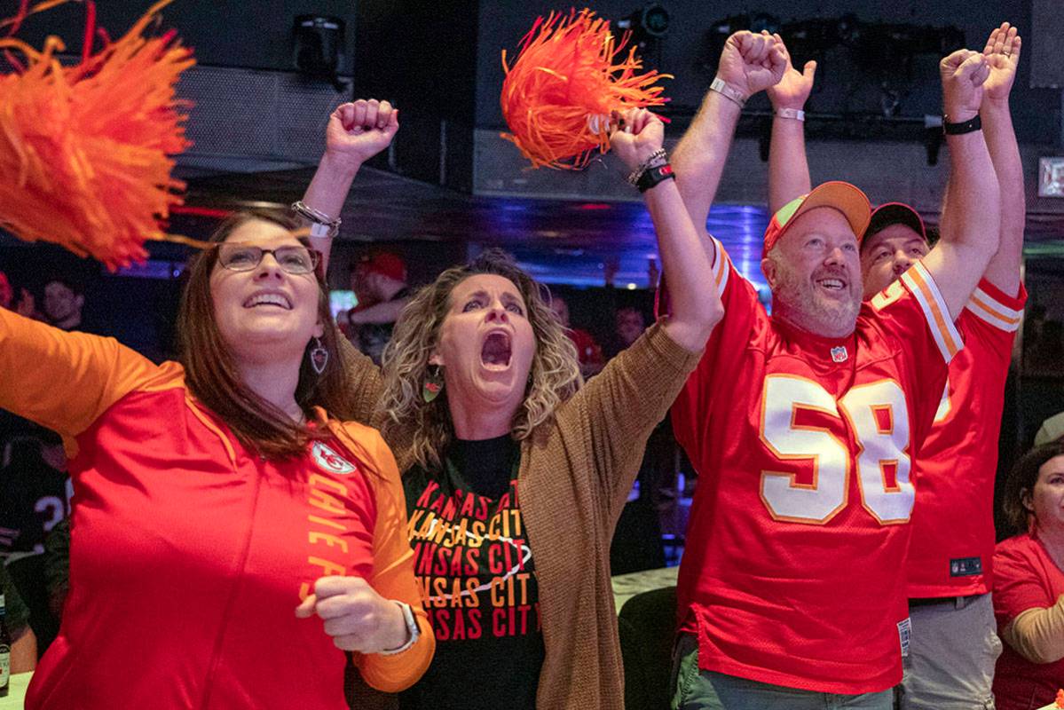 Kansas City Chiefs' fans Amy Teschner, left, Ashli Hanlan, center, and Mike Hanlen, of Kansas C ...