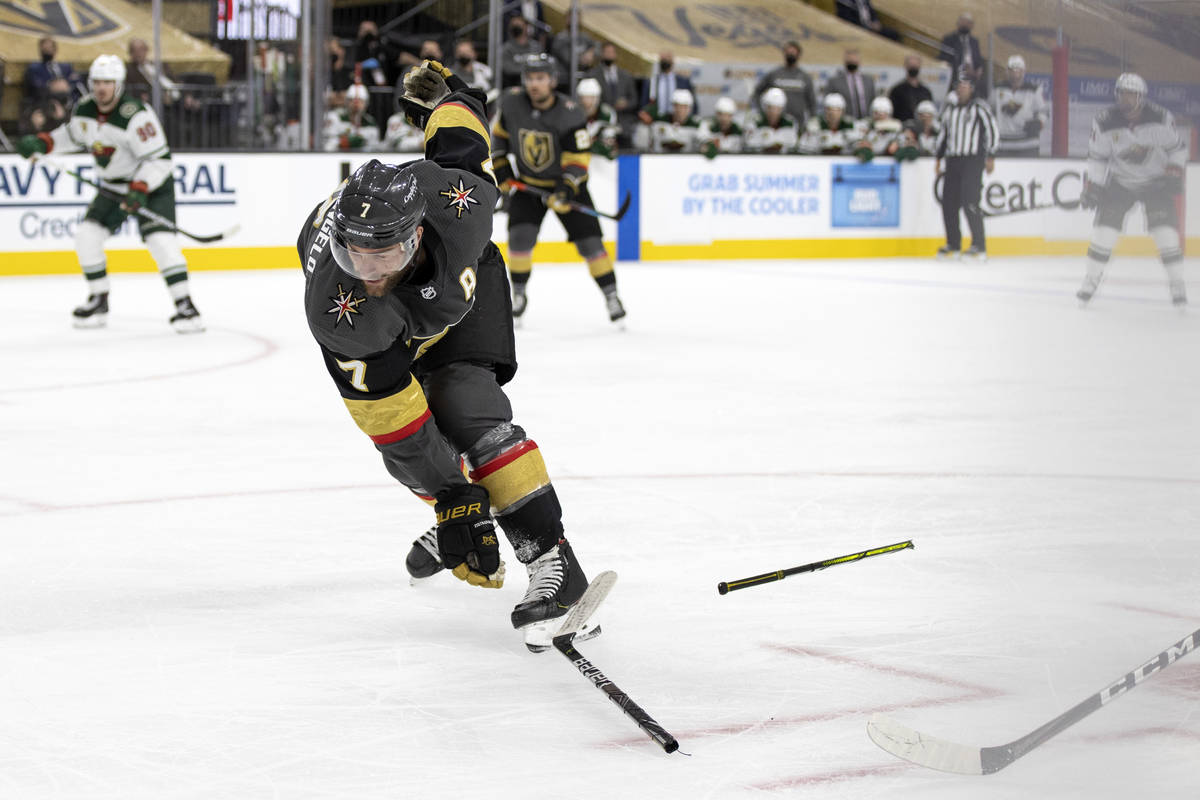 Golden Knights defenseman Alex Pietrangelo (7) falls after breaking his hockey stick during the ...