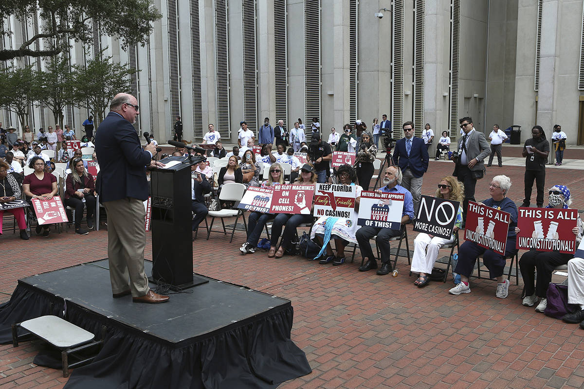 Pastor Kevin Baird speaks to a crowd protesting gambling at the Florida Capitol during a specia ...