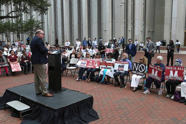 Pastor Kevin Baird speaks to a crowd protesting gambling at the Florida Capitol during a specia ...