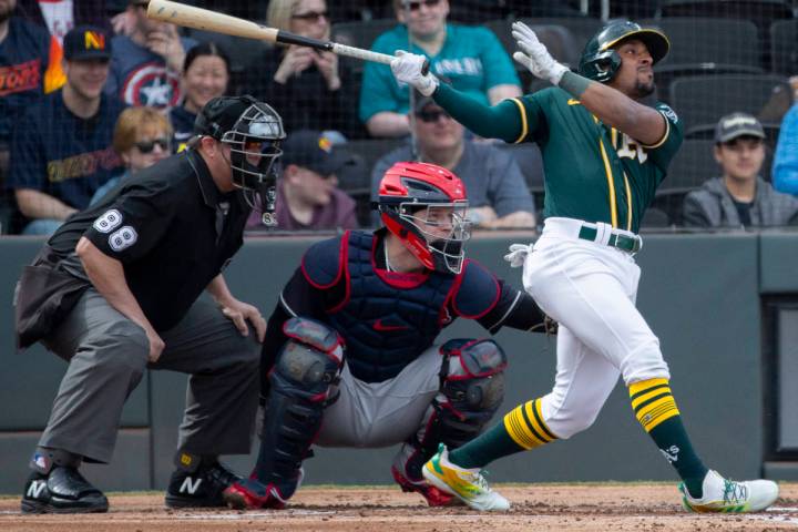 Oakland Athletics second baseman Tony Kemp (5) drives a ball to right field in the second innin ...