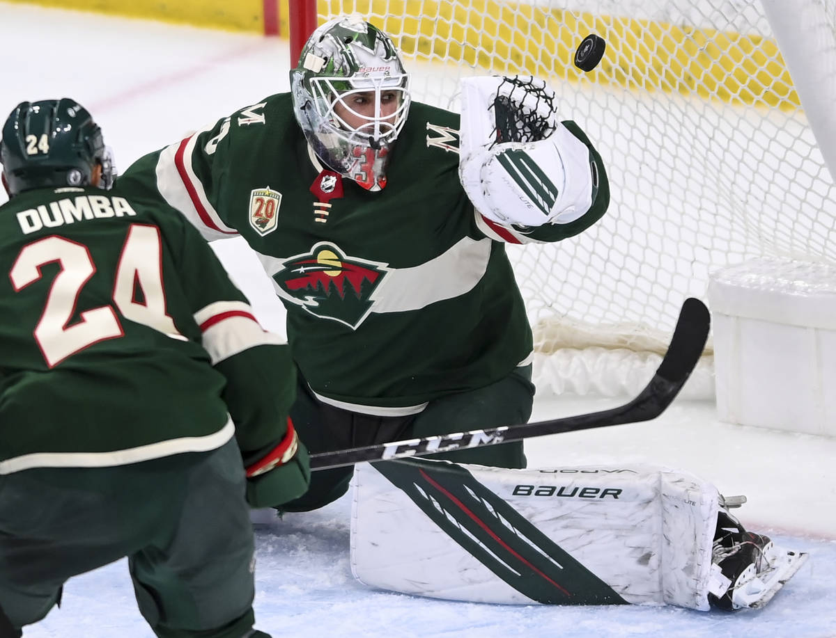 A shot by Vegas Golden Knights center Patrick Brown goes past the glove of Minnesota Wild goalt ...