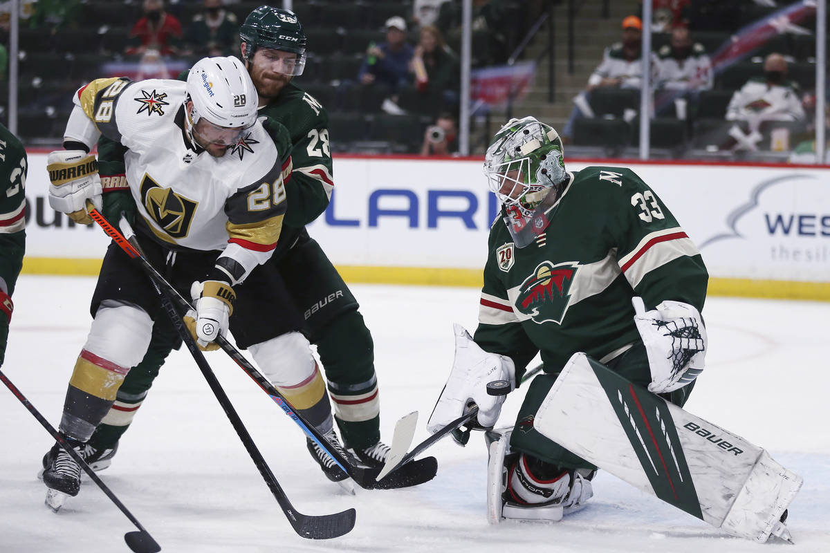 Minnesota Wild's goalie Cam Talbot (33) blocks the puck from the net against Vegas Golden Knigh ...