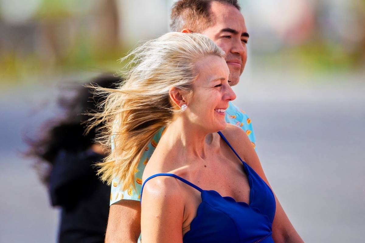 tephanie Roberts, from Dallas, waits to cross the street in high winds on the Strip on Thursday ...