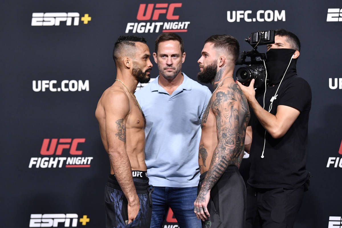 Rob Font, left, and Cody Garbrandt face off during the UFC Fight Night weigh-in at UFC APEX on ...