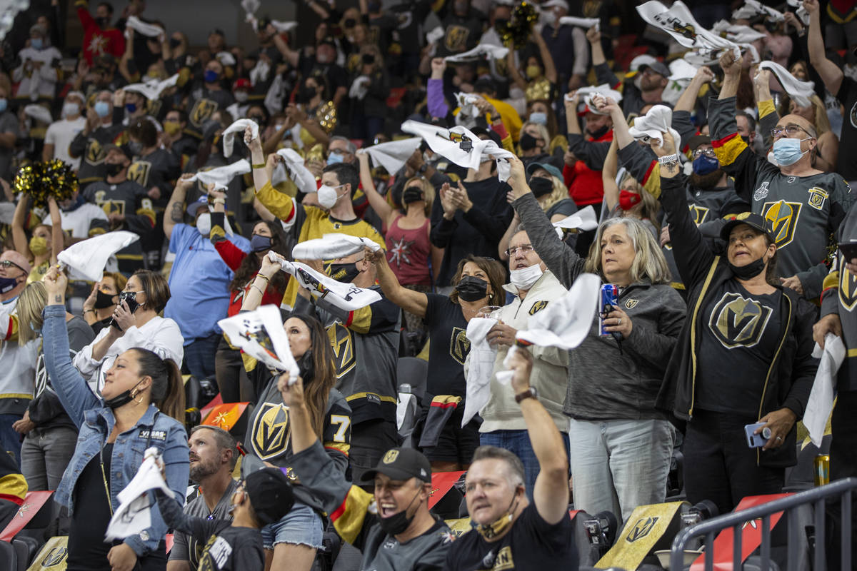 Golden Knights cheer on their team versus the Minnesota Wild during the first period of an NHL ...