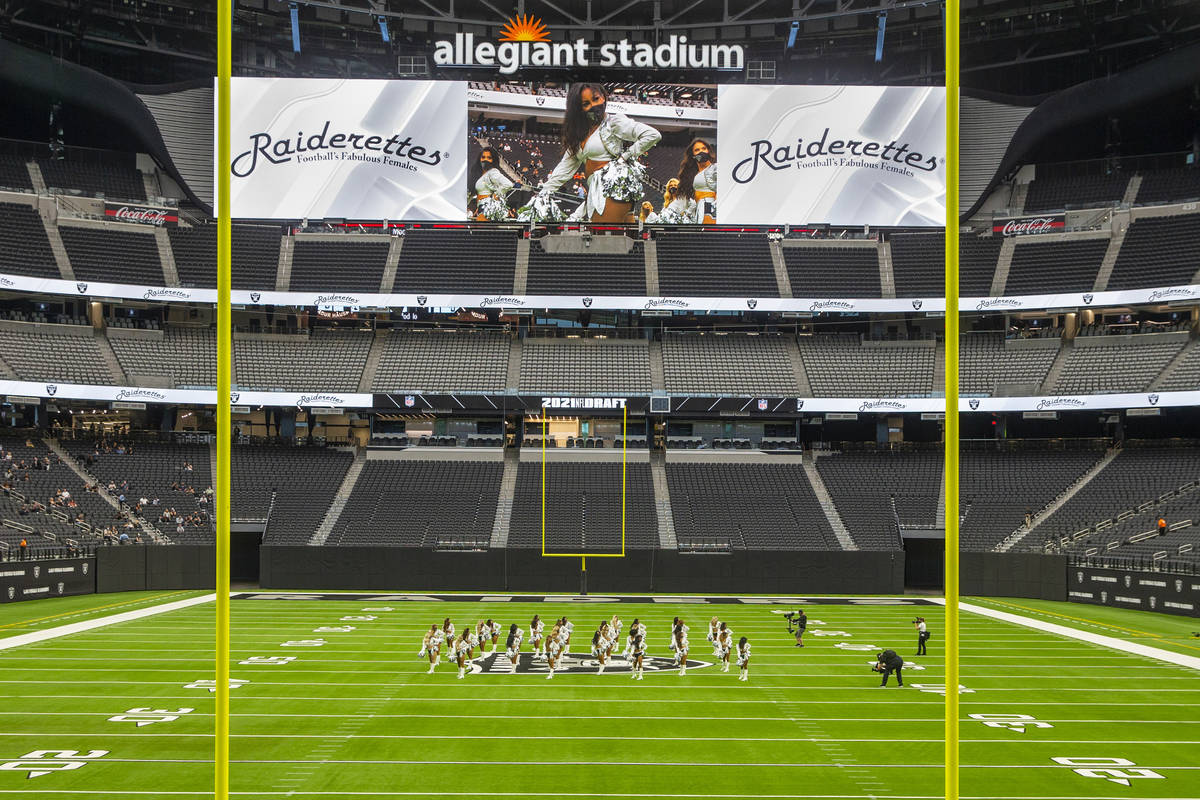 The Raiderettes leave the field before fans spread throughout the stands during the 2021 Las Ve ...