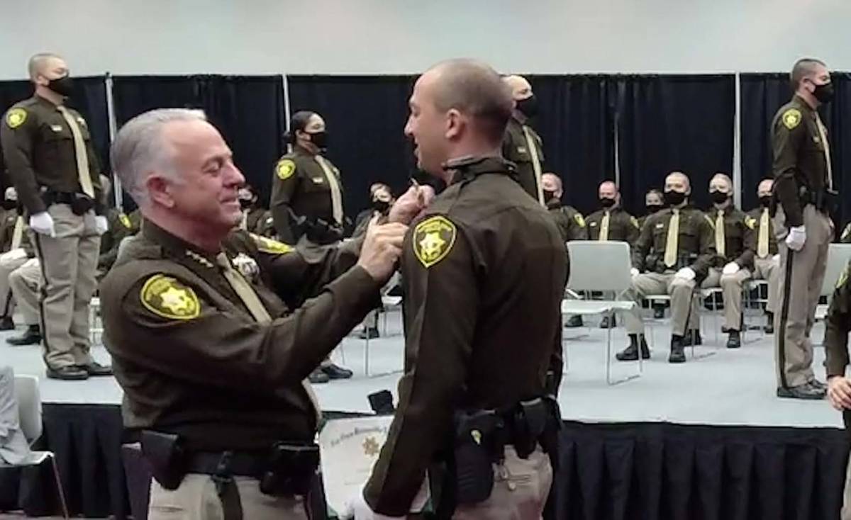 Clark County Sheriff Joe Lombardo pins a badge on one of the 81 Las Vegas Metropolitan Police D ...