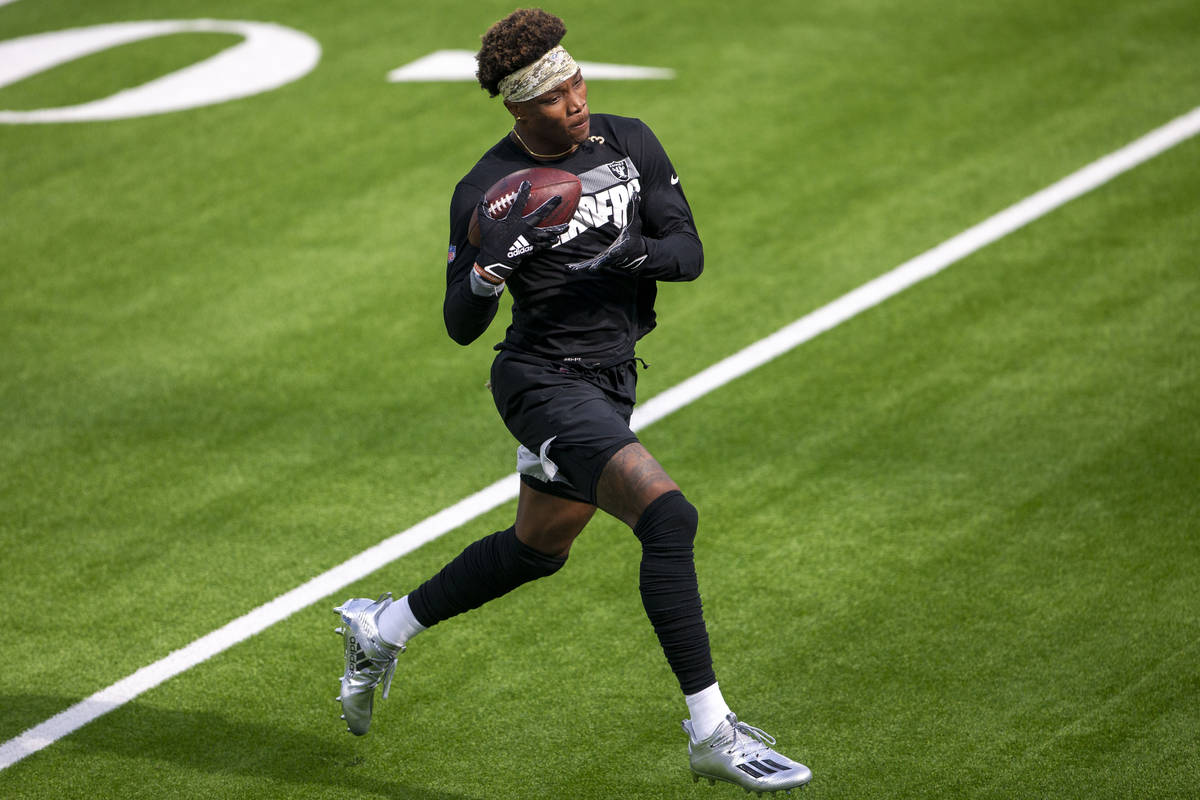 Las Vegas Raiders wide receiver Henry Ruggs III makes a catch before an NFL football game on Su ...