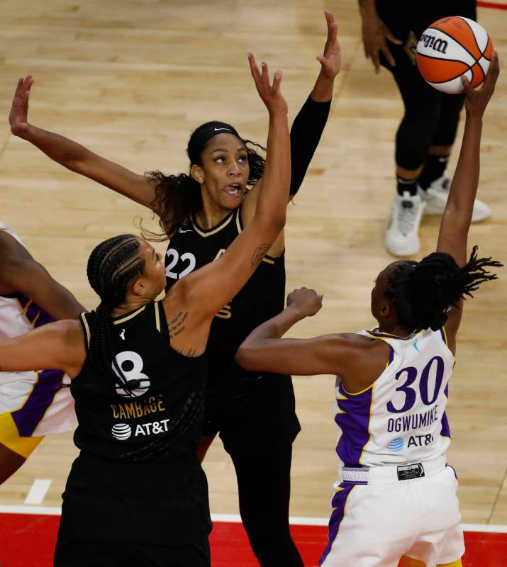 Los Angeles Sparks forward Nneka Ogwumike (30) looks to pass against Las Vegas Aces forward A'j ...