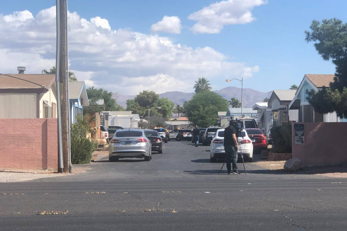 Police investigate a homicide Saturday, May 22, 2021, on the 3200 block of North Nellis Bouleva ...