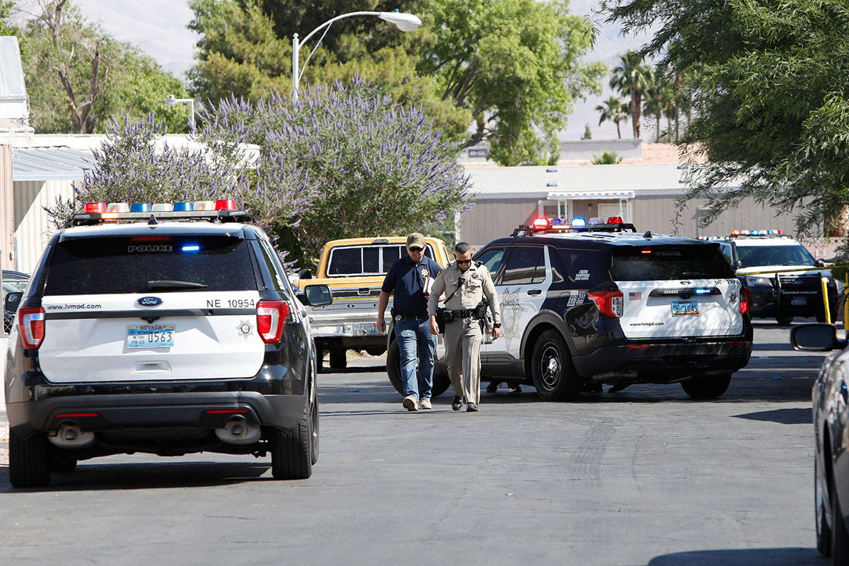 Police investigate a homicide Saturday morning, May 22, 2021, near the 3200 block of North Nell ...