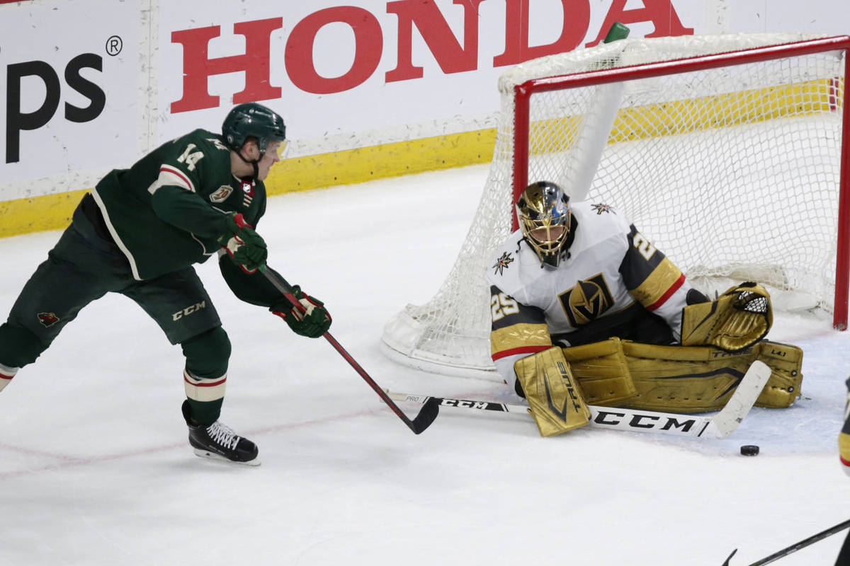 Vegas Golden Knights goaltender Marc-Andre Fleury (29) stops Minnesota Wild center Joel Eriksso ...