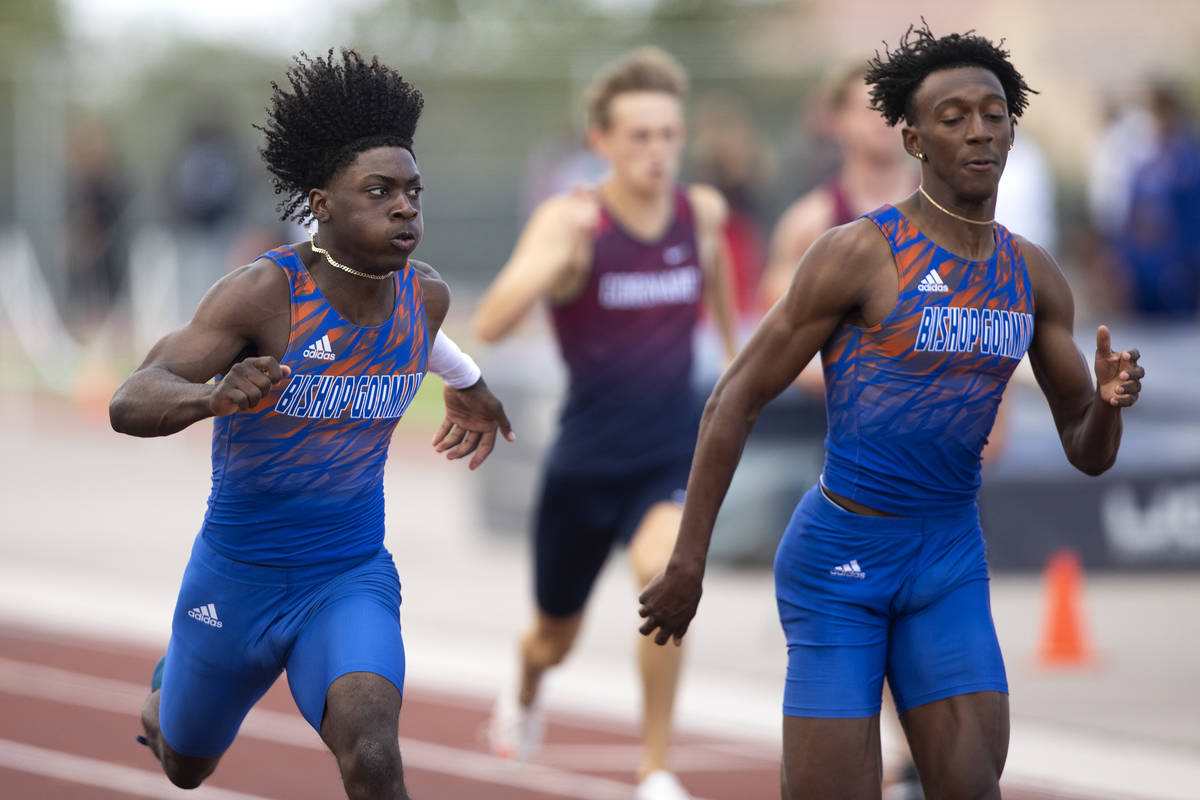 Bishop Gorman's Zachariah Branch, left, and Maleik Pabon compete in the boys 200 meter dash dur ...