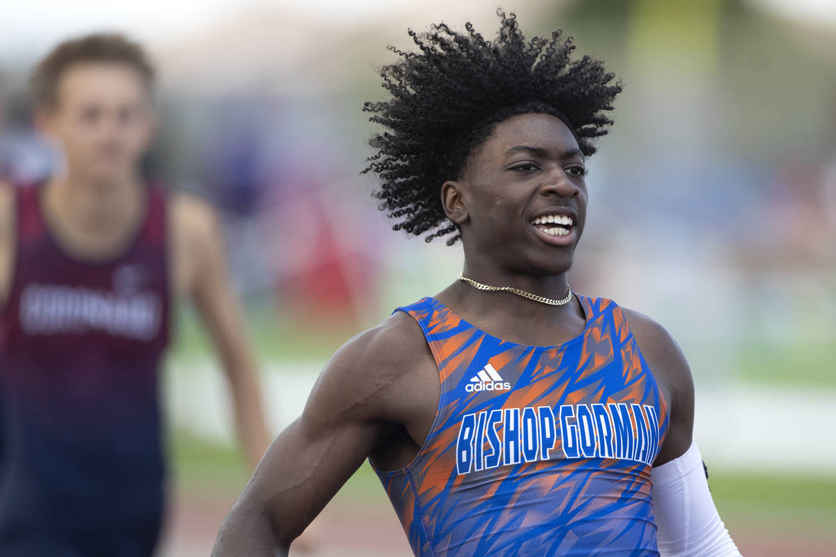 Bishop Gorman's Zachariah Branch runs through the finish line after winning the boys 200 meter ...