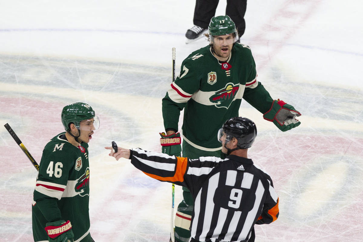 Minnesota Wild defenseman Jared Spurgeon (46) and Marcus Foligno (17) argue an interference cal ...