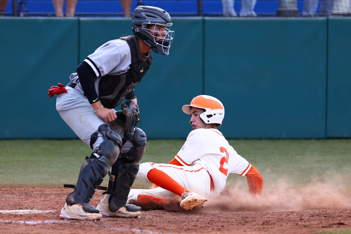 Bishop Gorman High's outfielder Tommy Rose scores as Palo Verde's catcher Aric Anderson waits f ...