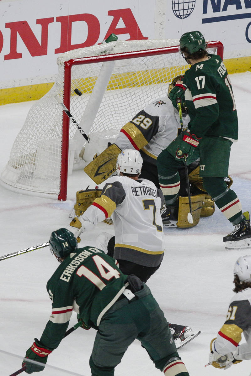 Minnesota Wild center Joel Eriksson Ek (14) scores a goal which was negated on an interference ...