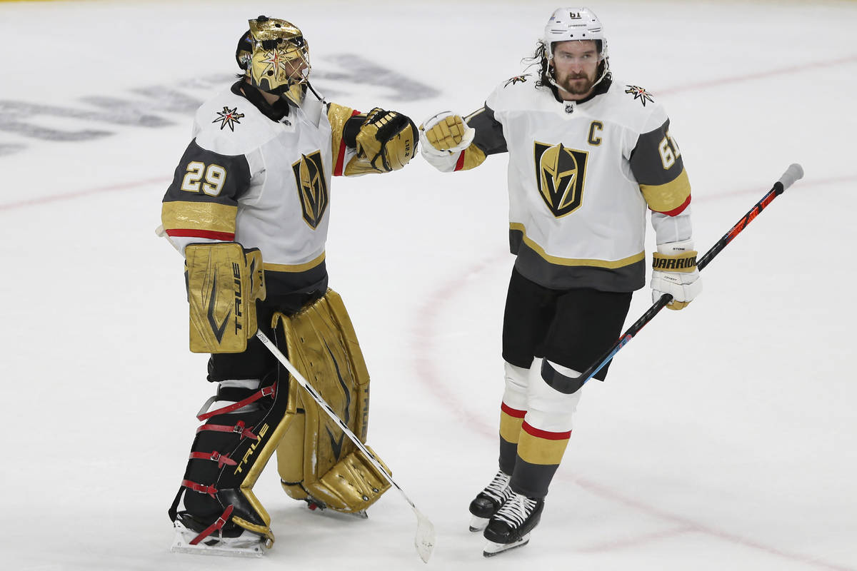 Vegas Golden Knights' goalie Marc-Andre Fleury (29) congratulates teammate Mark Stone (61) afte ...