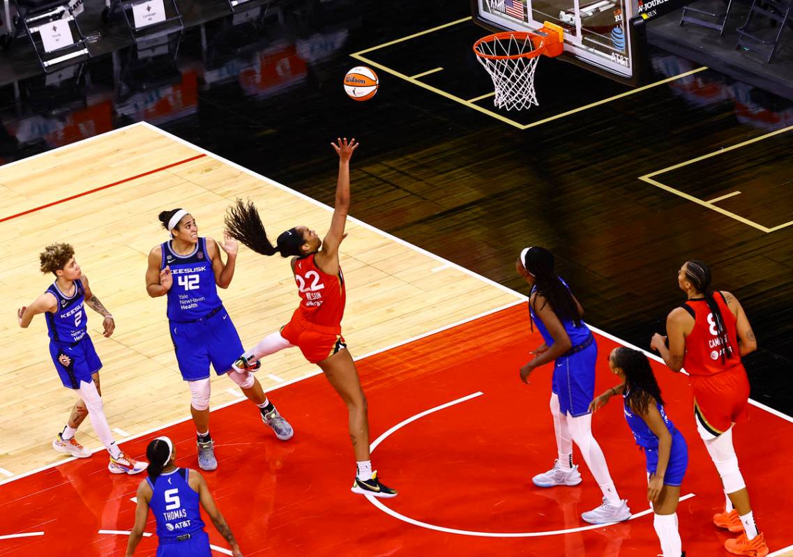 Las Vegas Aces' A'ja Wilson (22) shoots in front of Connecticut Sun's Brionna Jones (42) during ...