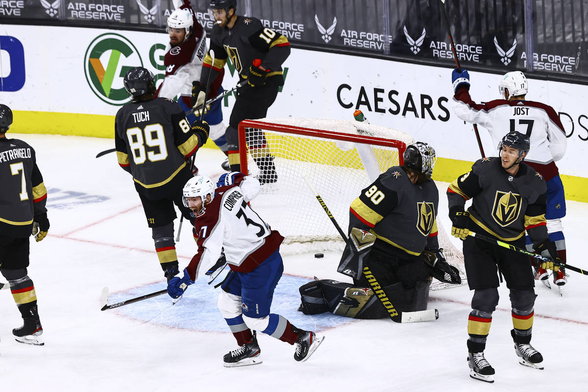 Colorado Avalanche's J.T. Compher (37) celebrates after scoring a goal past Golden Knights goal ...