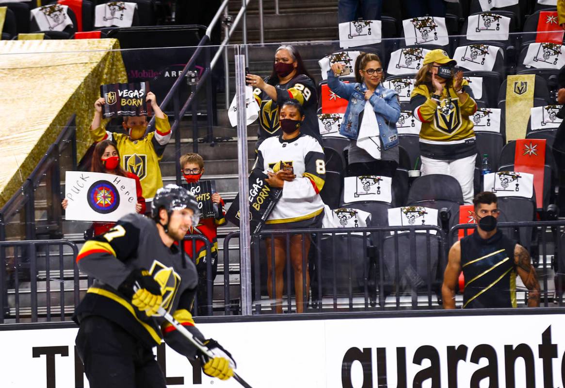 Golden Knights fans cheer as the team warms up for Game 5 of a first-round NHL hockey playoff s ...