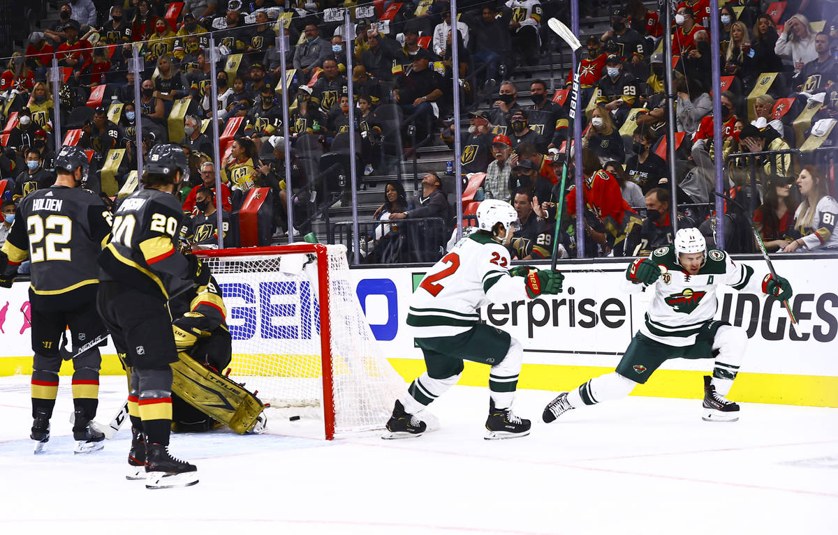 Minnesota Wild's Zach Parise, right, celebrates his goal against the Golden Knights alongside t ...