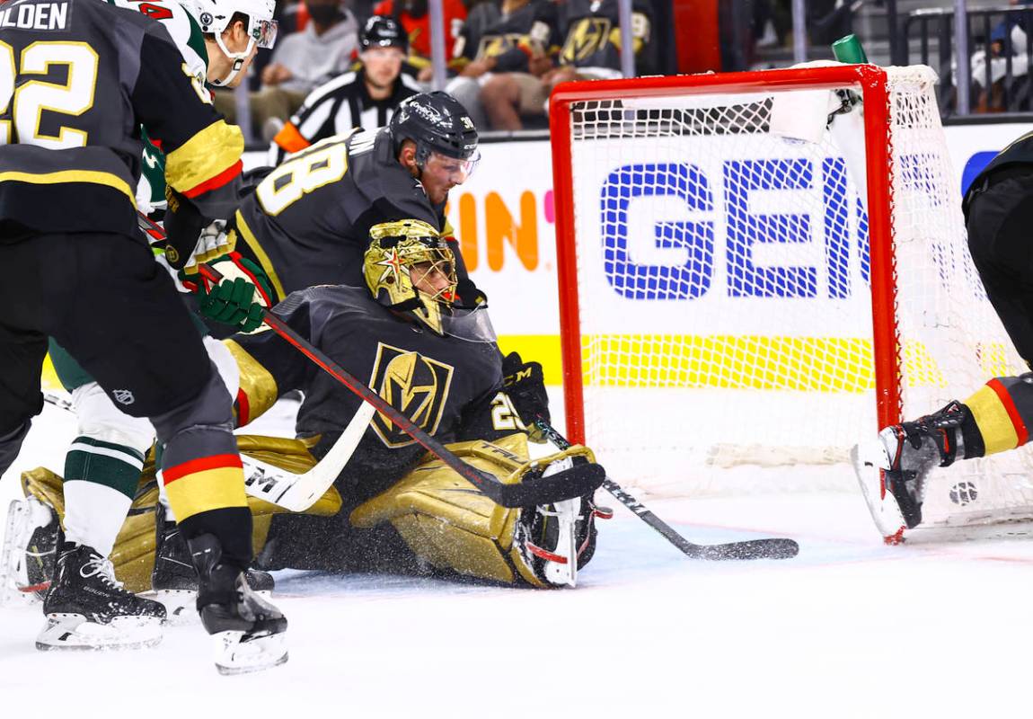 Golden Knights goaltender Marc-Andre Fleury (29) gives up a goal to Minnesota Wild's Jordan Gre ...