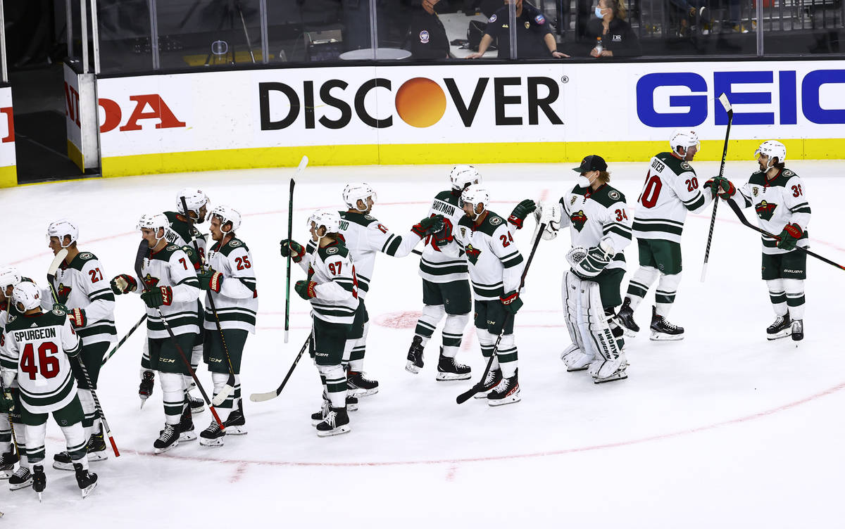 The Minnesota Wild celebrate their Game 5 win over the Golden Knights in a first-round NHL hock ...