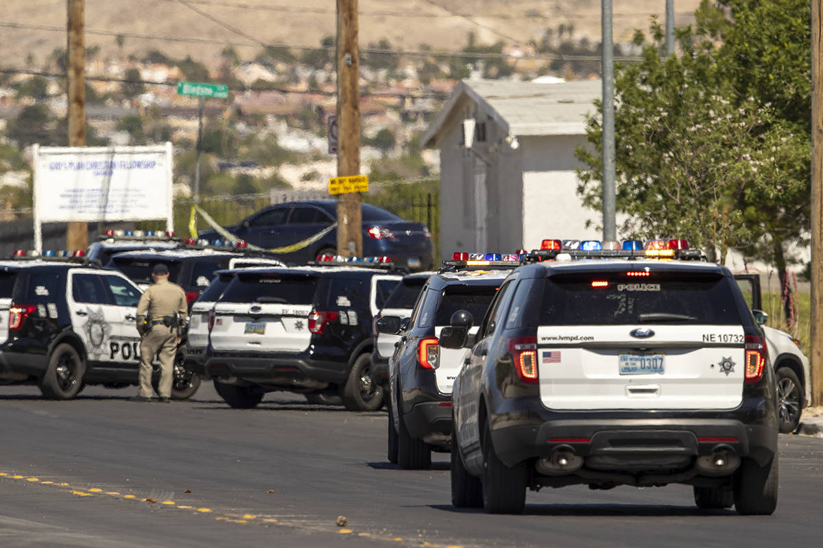 Metro officers and military personnel arrive at East Carey Avenue near Bledsoe Lane after a Nel ...