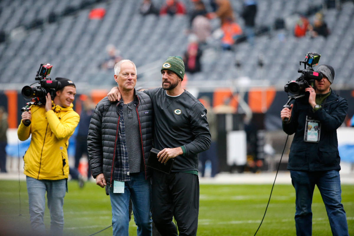 Green Bay Packers' Aaron Rodgers, right, talk to ESPN's Kenny Mayne before an NFL football game ...