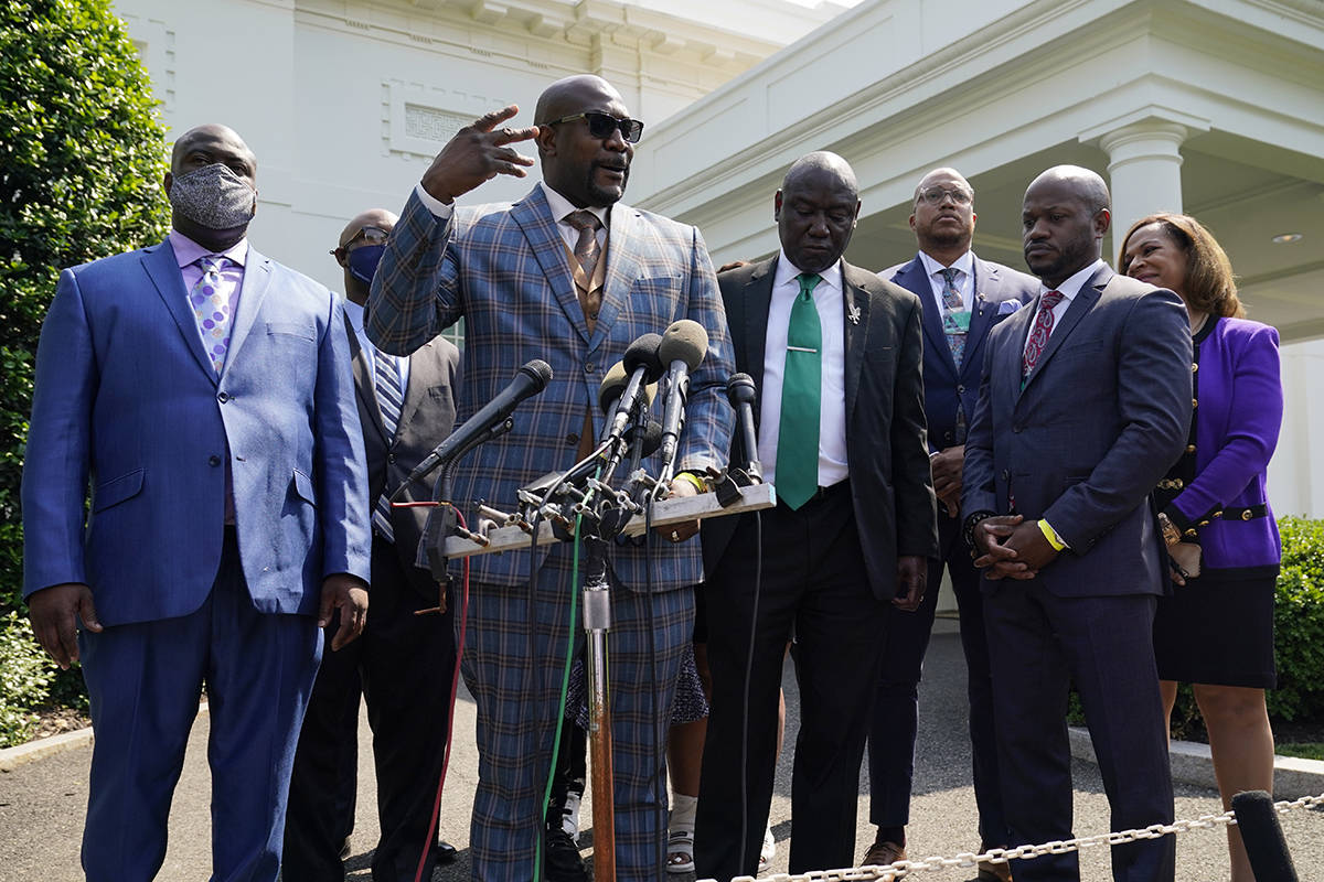 Philonise Floyd, the brother of George Floyd, talks with reporters with other family members af ...