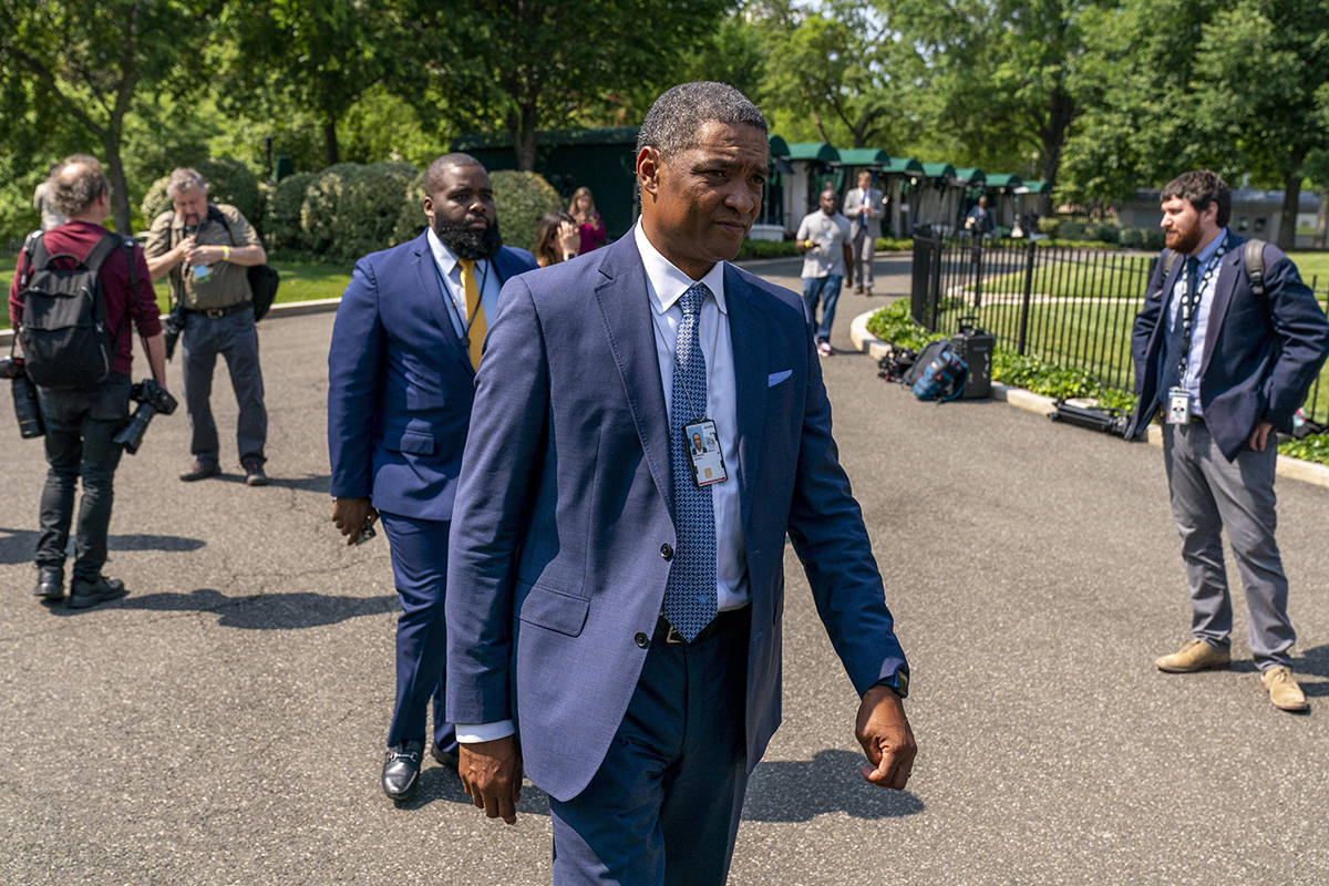 Director of the White House Office of Public Engagement Cedric Richmond, center, listens as Phi ...