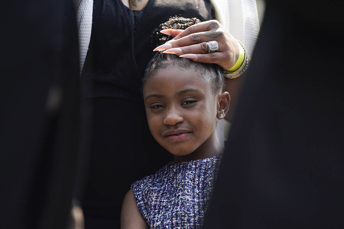 Gianna Floyd, the daughter of George Floyd, listens as family members speak to reporters after ...