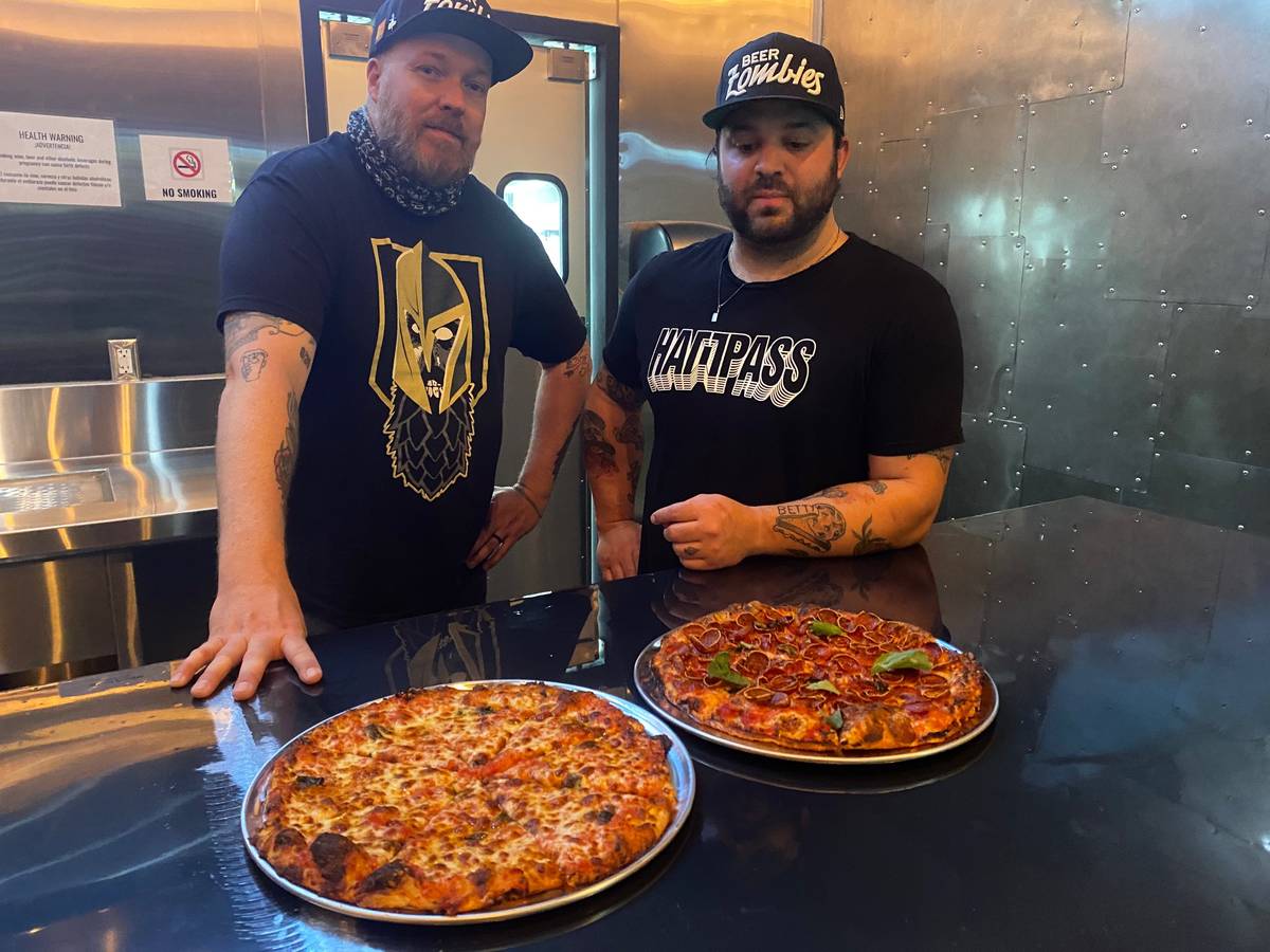 Chris Jacobs, left, and Marc Marrone show off tavern pies that will be served at the new Beer Z ...