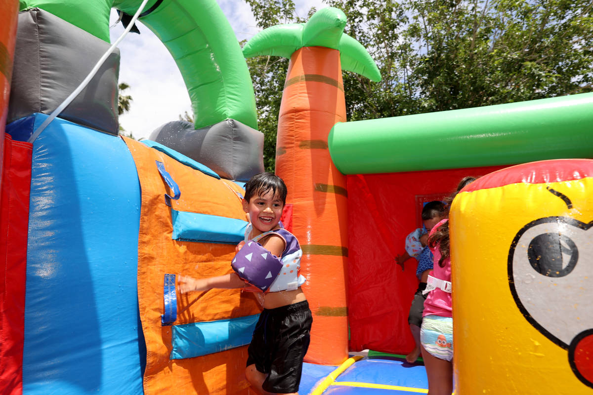 Benjamin David Hairr, 4, plays in a bounce house at his Henderson home after being officially a ...