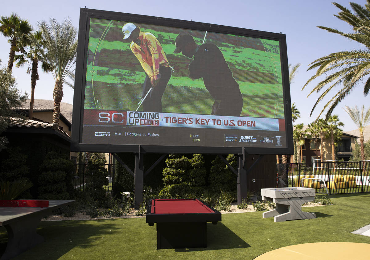 A giant television, ping pong table and pool table are seen near a pool area at the Tuscan High ...