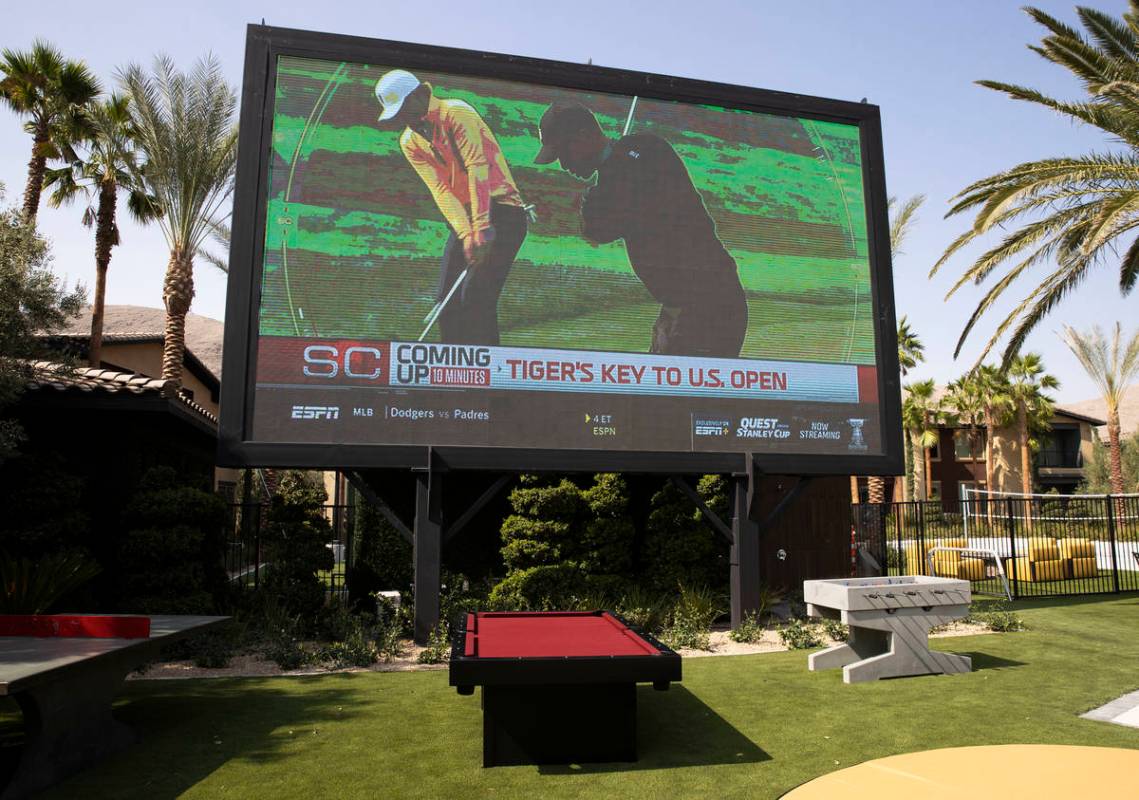 A giant television, ping pong table and pool table are seen near a pool area at the Tuscan High ...