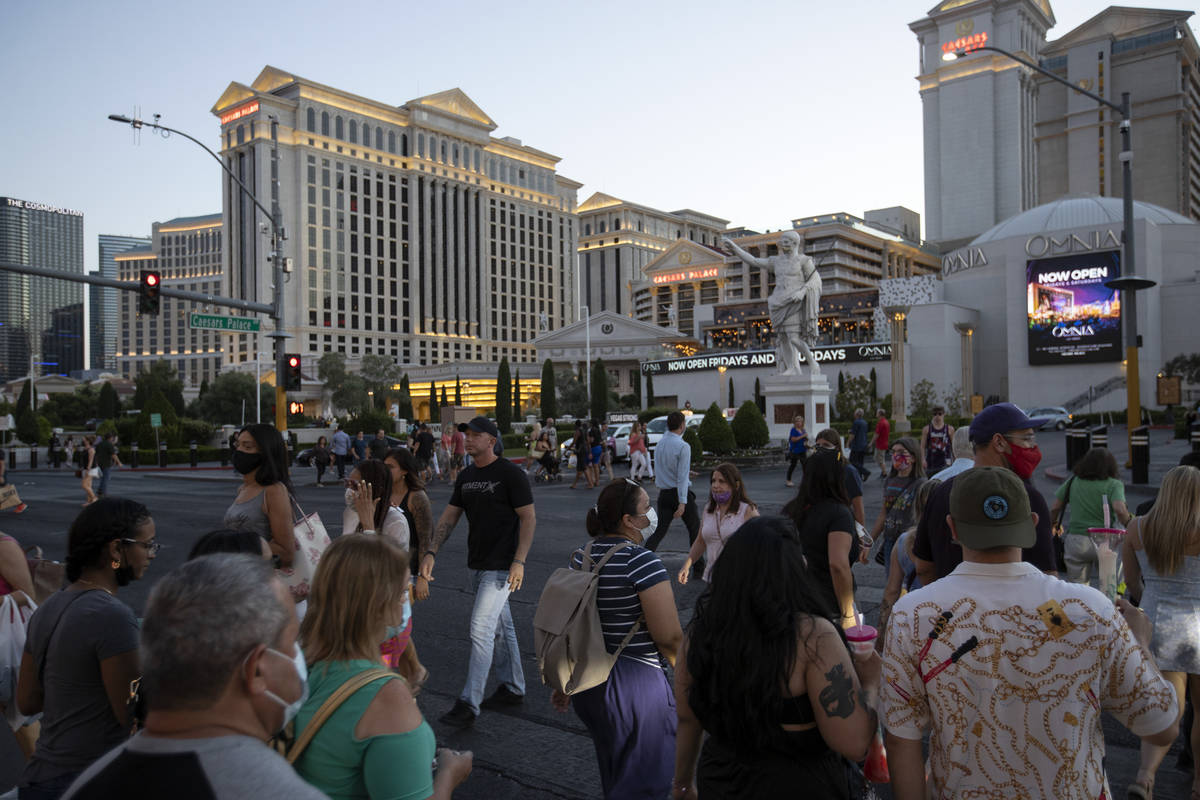 Some visitors to the Las Vegas Strip outside Caesars Palace on Thursday, May 13, 2021, in Las V ...